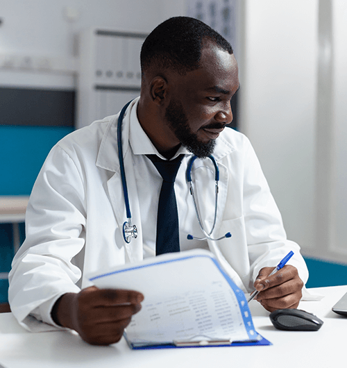 Physician consulting with patient about orphan drug access through Named Patient Programs in Nigeria